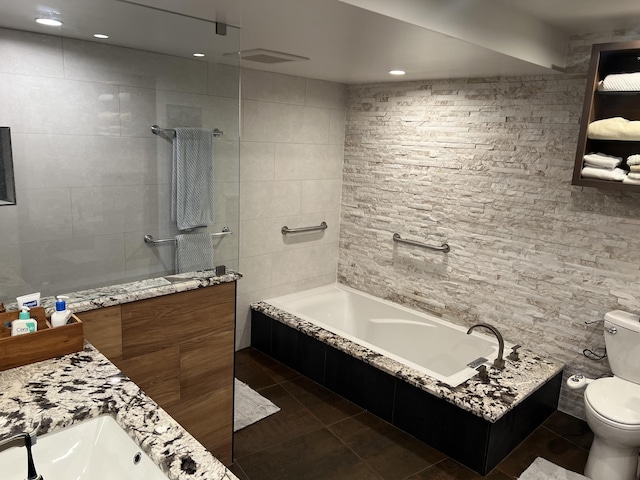 bathroom with toilet, tile patterned flooring, a walk in shower, and a bath