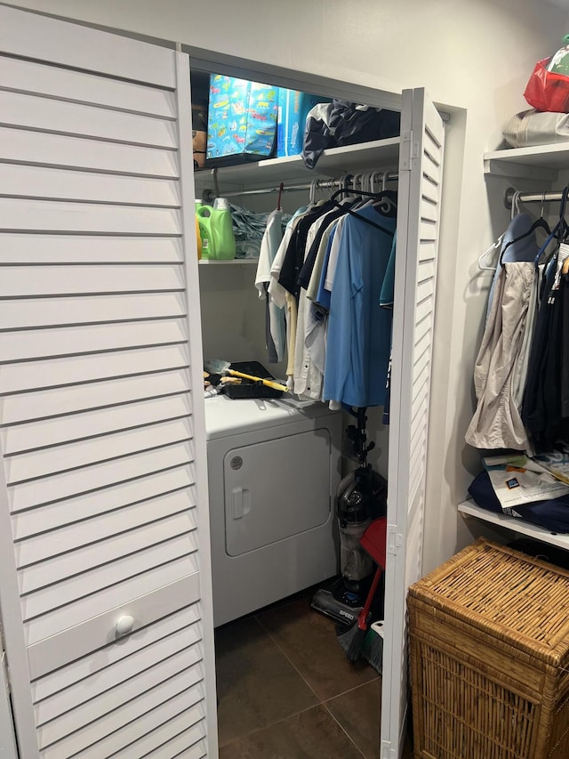 laundry area featuring washer / dryer, tile patterned flooring, and laundry area