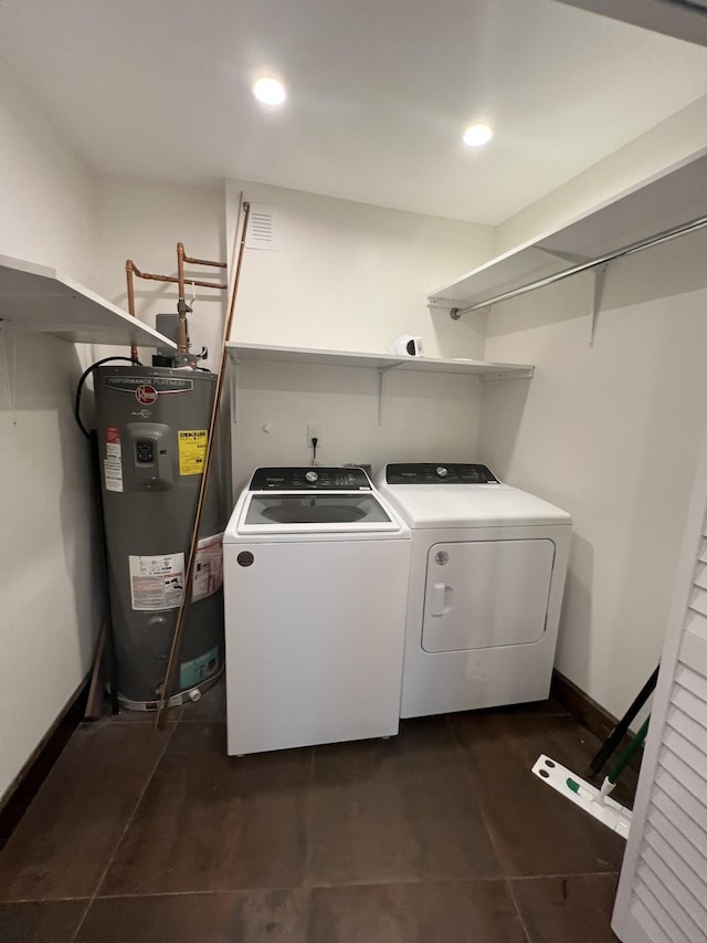 laundry area featuring laundry area, baseboards, washer and clothes dryer, water heater, and recessed lighting