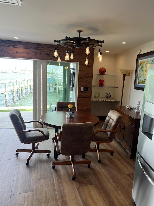 dining area featuring wood finished floors and recessed lighting