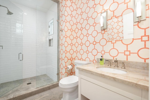 full bathroom with toilet, a shower stall, and vanity