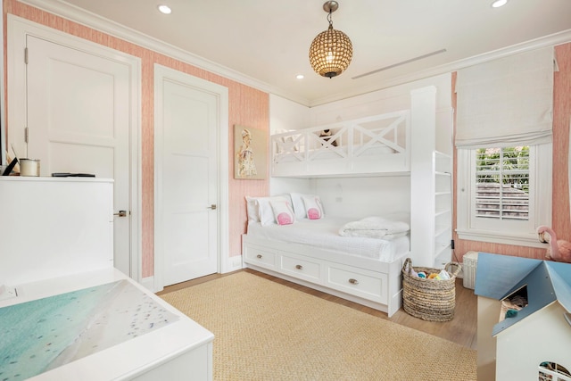 bedroom with ornamental molding, light wood-type flooring, and recessed lighting