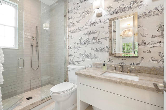 bathroom with plenty of natural light, a shower stall, toilet, and wallpapered walls