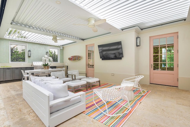 exterior space featuring an outdoor living space and a ceiling fan