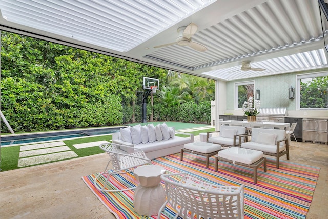 view of patio with an outdoor pool, ceiling fan, grilling area, and an outdoor hangout area