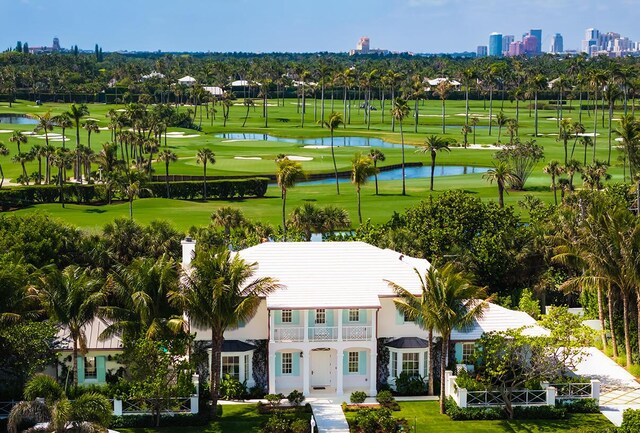 birds eye view of property featuring a city view, a water view, and golf course view