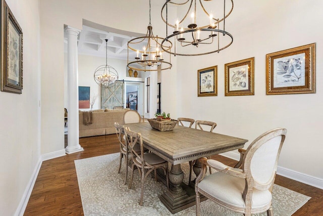 dining space featuring ornate columns, coffered ceiling, dark wood finished floors, and baseboards