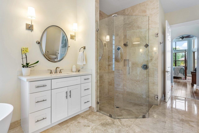 full bath featuring ensuite bathroom, marble finish floor, a stall shower, and vanity