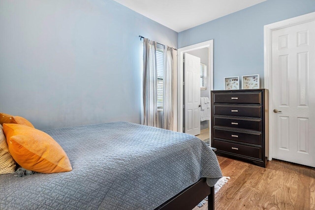 bedroom with light wood-style floors