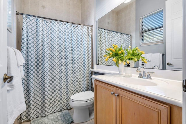 bathroom with vanity, toilet, and a shower with curtain