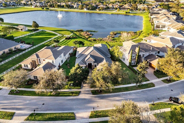 aerial view featuring a residential view and a water view