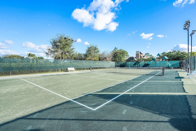 view of sport court with fence