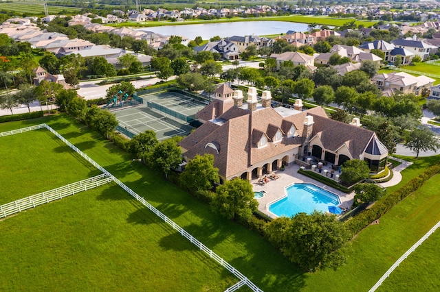 bird's eye view with a water view and a residential view