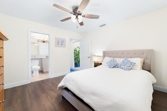 bedroom featuring baseboards, visible vents, and dark wood-type flooring