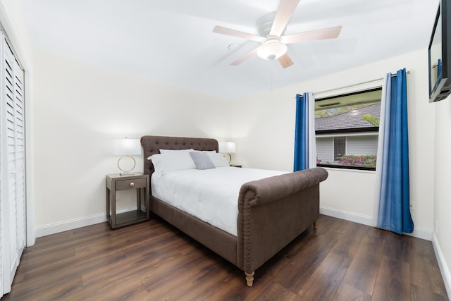 bedroom featuring dark wood-type flooring, a ceiling fan, and baseboards