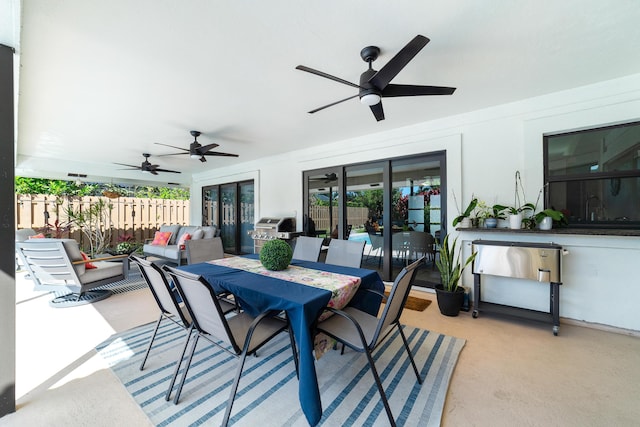 view of patio / terrace featuring ceiling fan, outdoor dining area, and fence