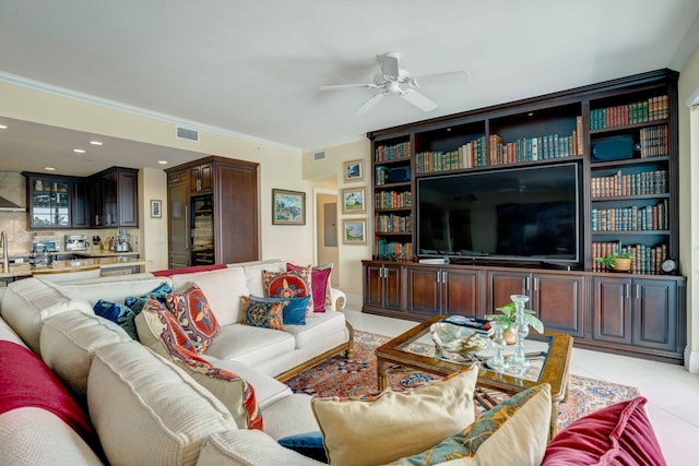 living room featuring visible vents, ornamental molding, ceiling fan, and light tile patterned flooring