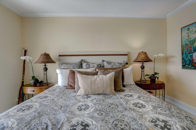 bedroom with ornamental molding and baseboards