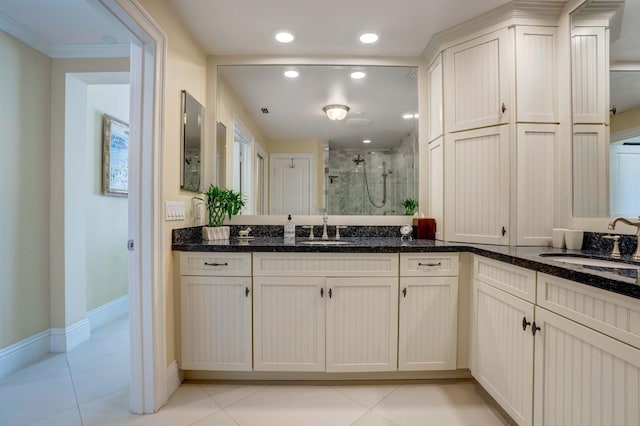 interior space featuring a stall shower, recessed lighting, vanity, and tile patterned floors