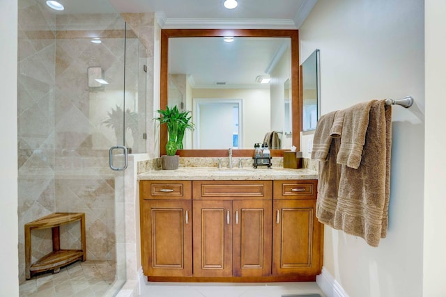 bathroom with ornamental molding, a stall shower, vanity, and recessed lighting