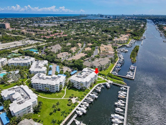 birds eye view of property with a water view