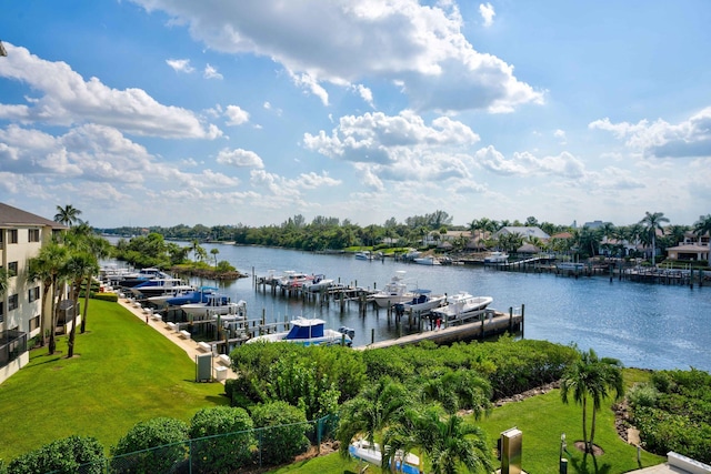 dock area featuring a water view and a lawn