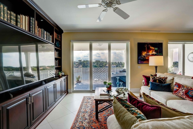 living room featuring light tile patterned flooring, crown molding, and ceiling fan