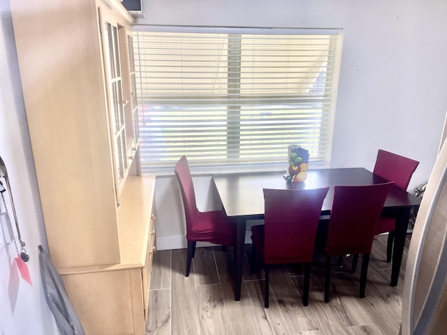 dining area with light wood finished floors