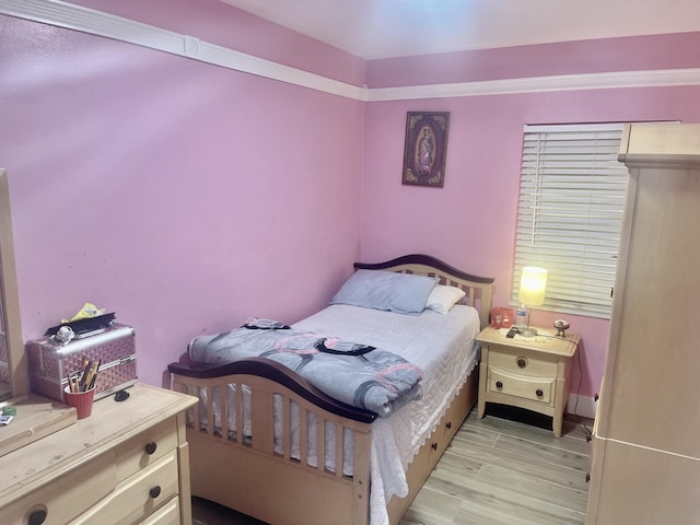 bedroom featuring light wood-style flooring