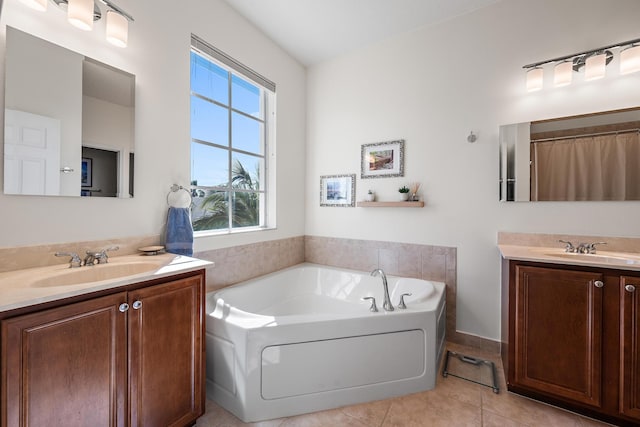 full bathroom with two vanities, a sink, and tile patterned floors