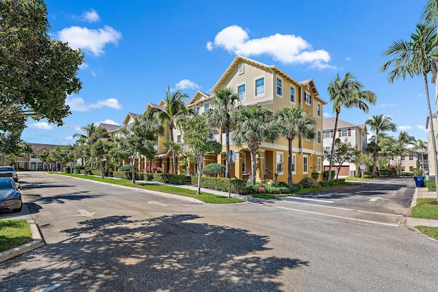 view of street featuring curbs, sidewalks, and a residential view