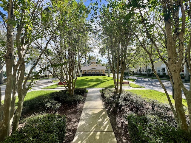 view of community with a residential view and a yard