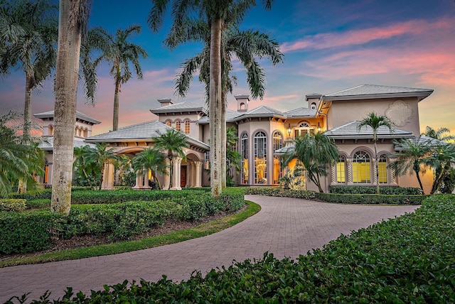 mediterranean / spanish-style house with decorative driveway