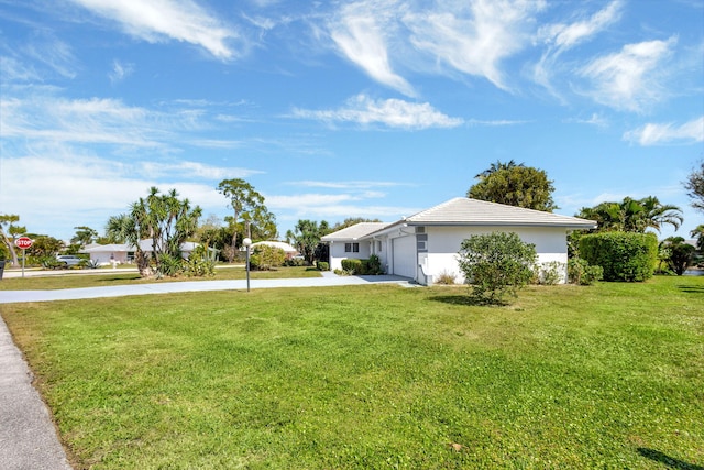 exterior space with a garage and concrete driveway