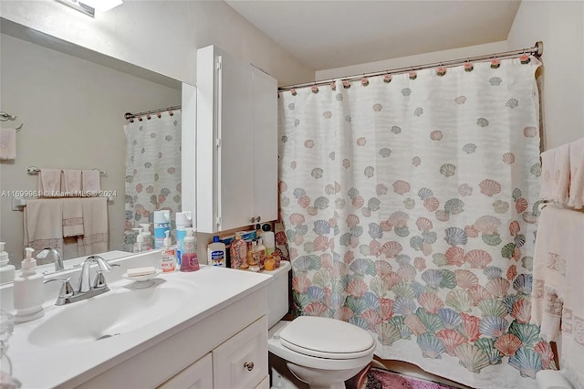 full bath featuring curtained shower, vanity, and toilet