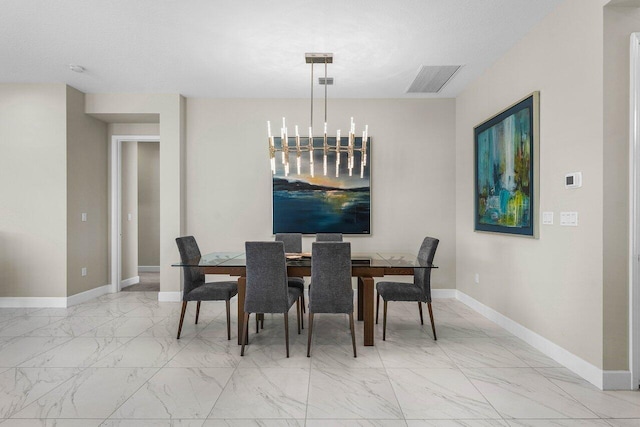 dining space featuring a chandelier, marble finish floor, visible vents, and baseboards