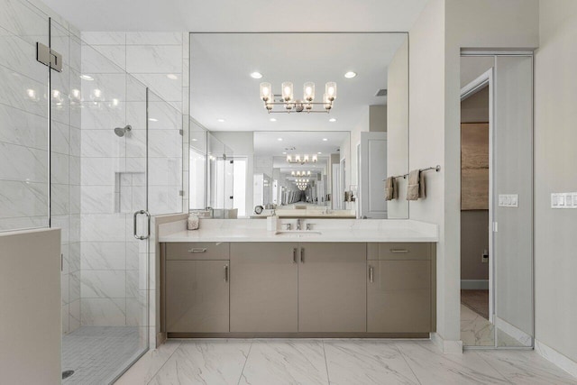 full bathroom with marble finish floor, an inviting chandelier, vanity, a shower stall, and recessed lighting