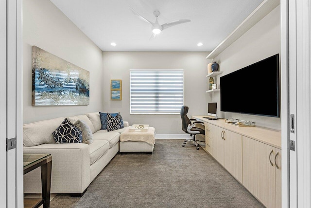 carpeted office space featuring recessed lighting, baseboards, a ceiling fan, and built in study area