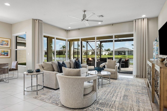 living room featuring ceiling fan, visible vents, and recessed lighting