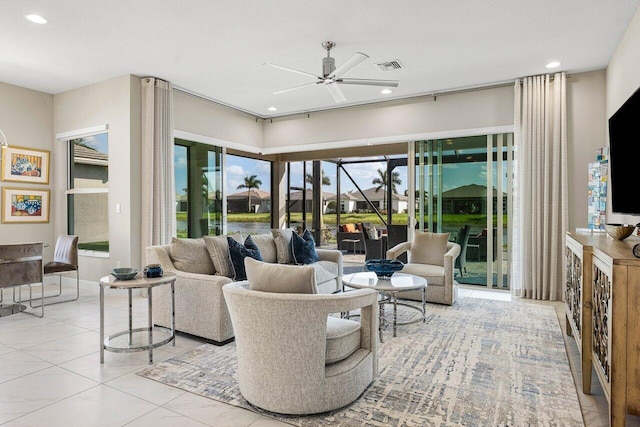 tiled living area with a ceiling fan, recessed lighting, and visible vents