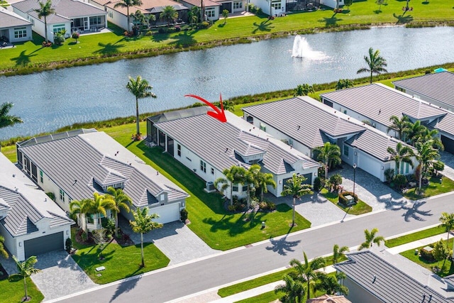 aerial view with a residential view and a water view