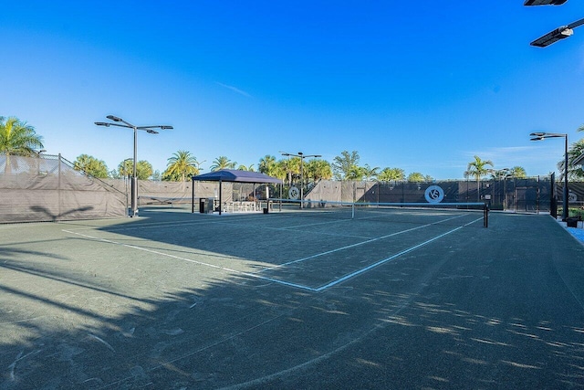 view of sport court with fence