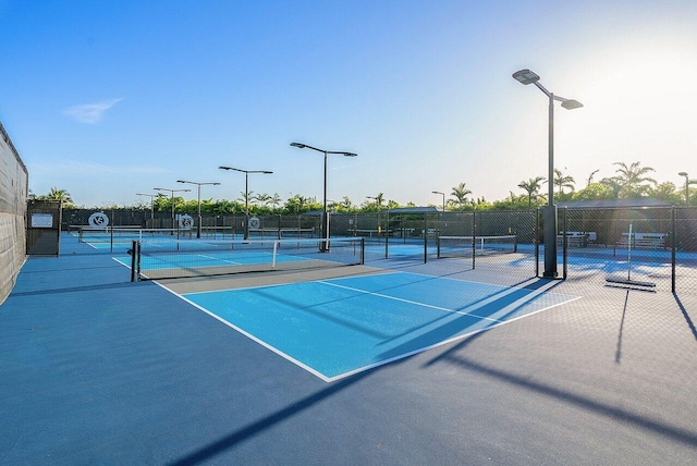 view of tennis court with fence