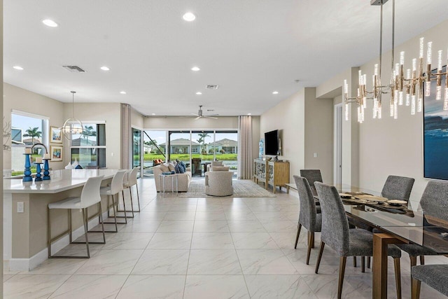 dining area featuring marble finish floor, visible vents, and recessed lighting