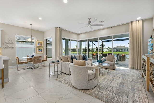 living room with a ceiling fan, recessed lighting, visible vents, and a healthy amount of sunlight