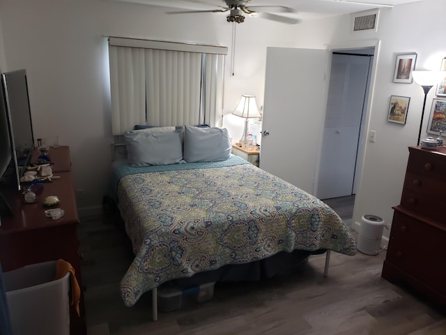 390 Brittany I, Delray Beach, FL 33446 - bedroom with a closet, visible vents, ceiling fan, and wood finished floors