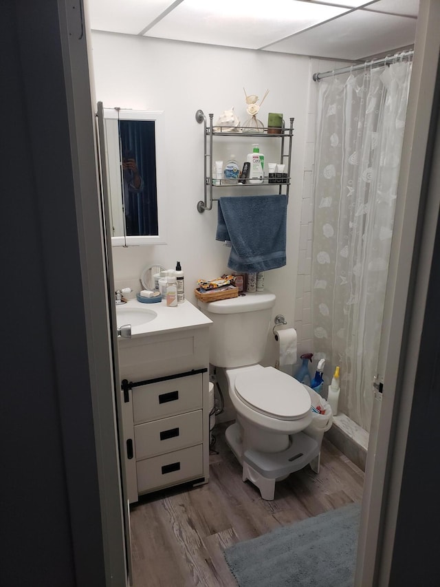 390 Brittany I, Delray Beach, FL 33446 - bathroom featuring toilet, wood finished floors, a shower stall, and vanity