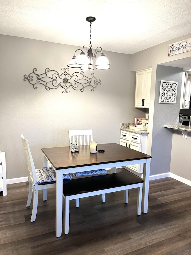 1548 SE Royal Green Cir Unit 105, Port Saint Lucie, FL 34952 - dining area featuring baseboards, dark wood-type flooring, and a chandelier