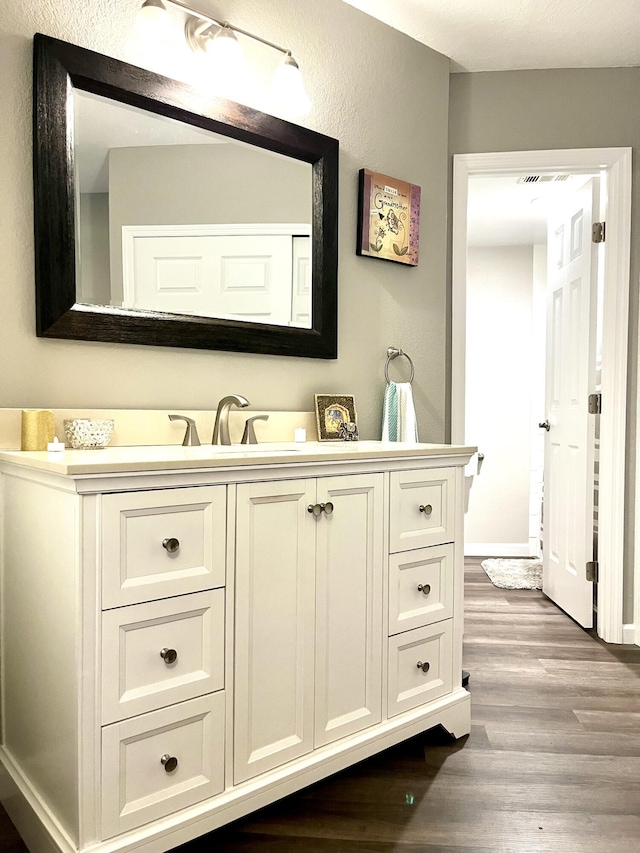 1548 SE Royal Green Cir Unit 105, Port Saint Lucie, FL 34952 - bathroom with wood finished floors and vanity