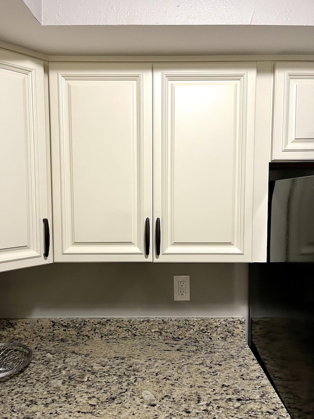 1548 SE Royal Green Cir Unit 105, Port Saint Lucie, FL 34952 - kitchen view of white cabinetry and light stone countertops
